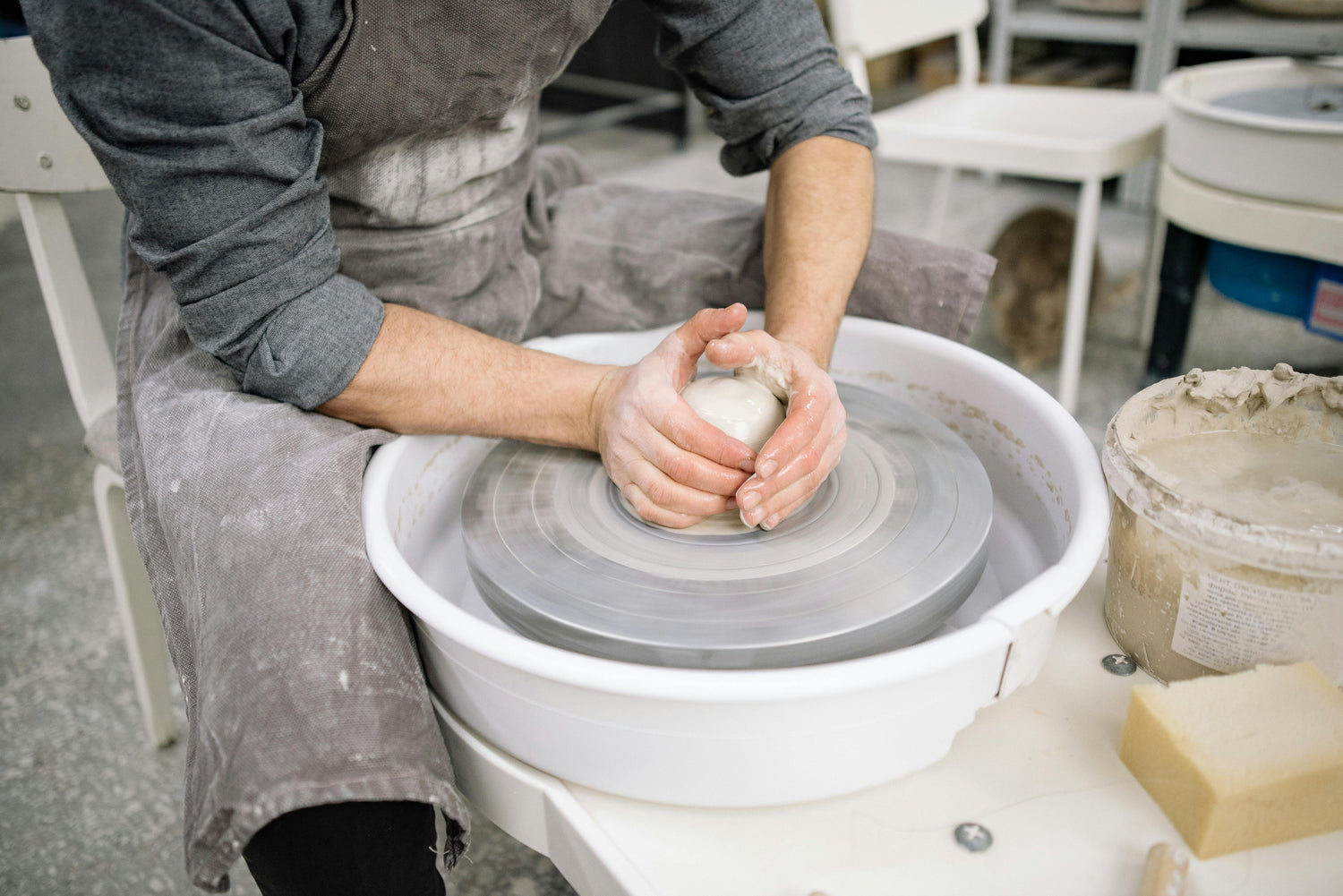 centering clay at a beginner pottery class at denver pottery studio
